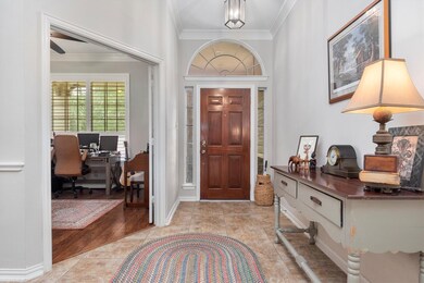 Upon entering the home, there is a welcoming entryway with a private home office separated from the rest of the home.