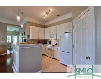 Kitchen. Open kitchen with white cabinets, stove, 