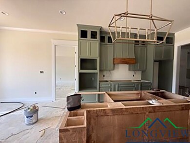Kitchen featuring baseboards and a center island