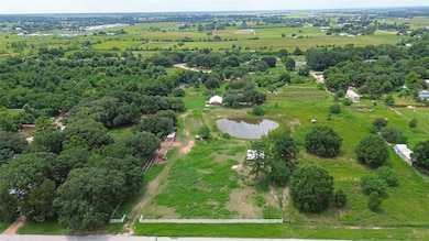 Expansive rural property featuring lush greenery,