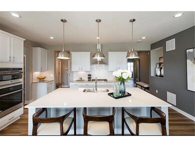 Photos of previously completed model home. Please see listing agent for home specific selections. Staged for furniture size reference.