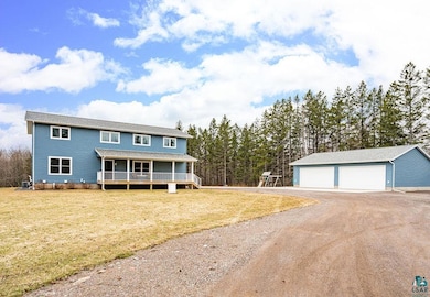 View of front of house featuring an outdoor struct