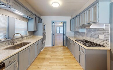Kitchen with a healthy amount of sunlight, light h