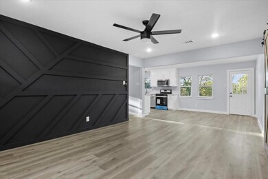 Unfurnished living room featuring visible vents, l