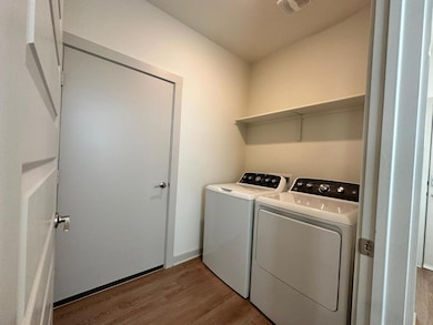 Laundry area with washing machine and clothes dry
