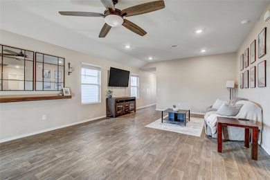 Living room with wood finished floors, a ceiling 