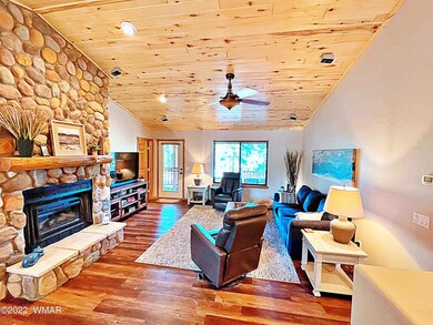 Stone Fireplace & Pine T&G Ceiling