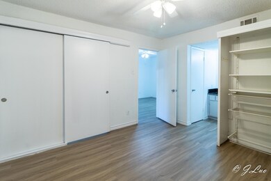 Unfurnished bedroom with visible vents, a ceiling 
