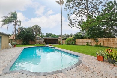 Private pool, fenced yard and extra structure that