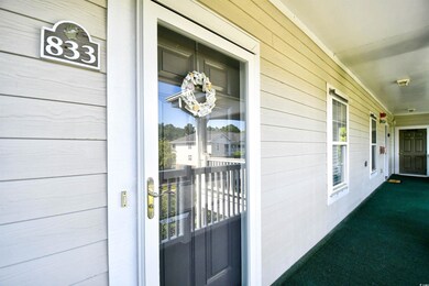 View of exterior entry with covered porch