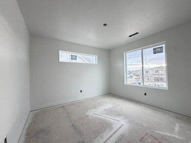 Empty room with baseboards and a textured ceiling