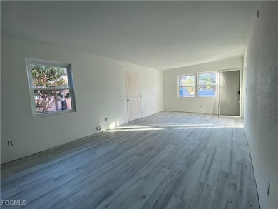 Empty room featuring wood finished floors