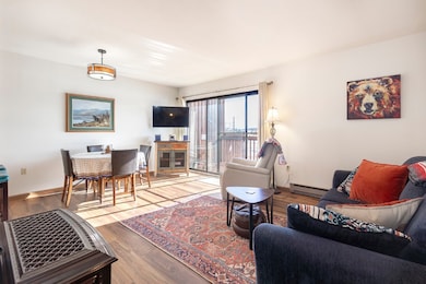 Living room with wood finished floors, baseboards,