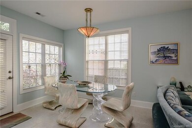 Breakfast area is open to kitchen and overlooks th