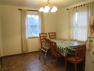 Dining room off kitchen, new lighting and sunny an