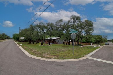 View of asphalt road featuring traffic signs and 