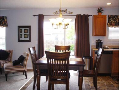 Breakfast Area/Room. BREAKFAST ROOM OPENS TO THE FAMILY ROOM AND KITCHEN WITH PATIO DOOR ONTO  THE DECK. UPDATED LIGHT FIXTURE OVER TABLE.