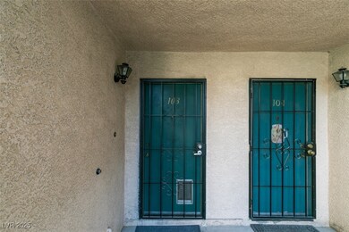 Entrance to property with stucco siding