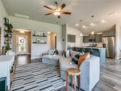 Living room open to kitchen and dining area