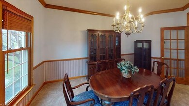 Formal dining room with french doors.