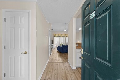 Foyer entrance with light wood-style flooring, a ceiling fan, and a textured ceiling