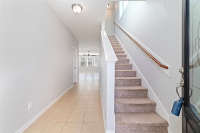 Large entryway leading into the living room. Stairs lead to all bedrooms & game room.