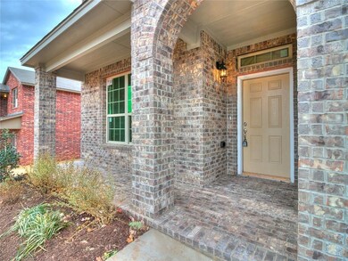 Porch  A lovely front porch and arched entry welco