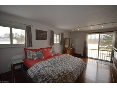 Master bedroom with hardwood floors and a beautifu