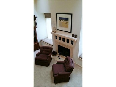 Another view of the fireplace and window seats.