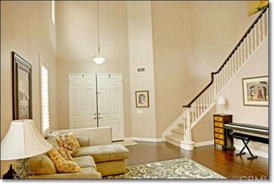 LIVING ROOM WITH HIGH CEILINGS