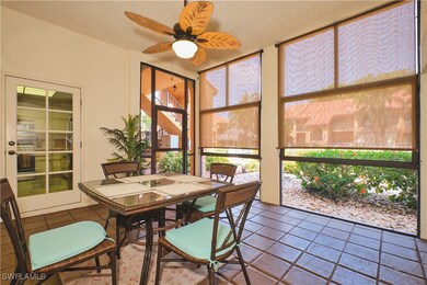 Sunroom featuring tile patterned floors, ceiling f