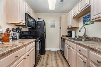 Kitchen featuring sink, light wood-type flooring, 