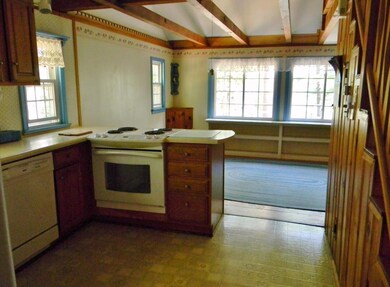 Kitchen with stairs to loft and...