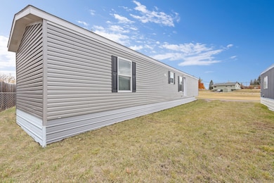 Full length view highlighting the durable vinyl siding and overall low-maintenance design