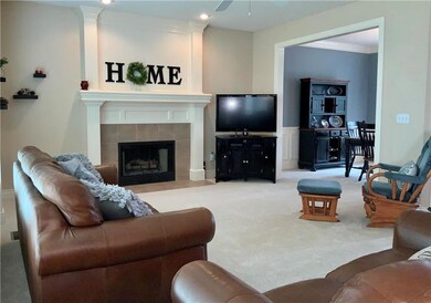 Spacious main level living room with gas fireplace