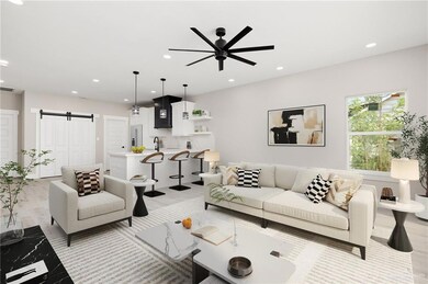 *VIRTUALLY STAGED* Living room with light wood-style tile floors, a barn door, and ceiling fan