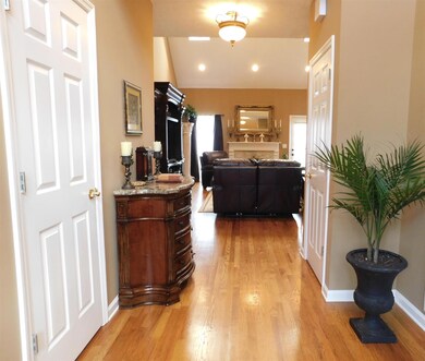 This entry to your home is inviting and leads to the family room with fireplace.