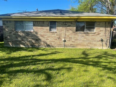 View of property exterior with a yard
