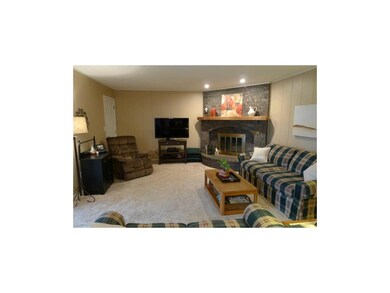 Comfortable great room highlighted by corner firep