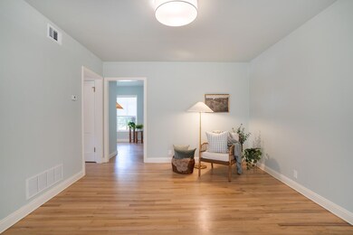 Sitting room with light wood-style floors