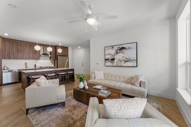 Living area with recessed lighting, light wood-st
