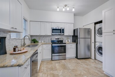 Kitchen featuring stainless steel appliances, sta