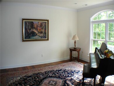 living room recessed lighting, hardwood floors.