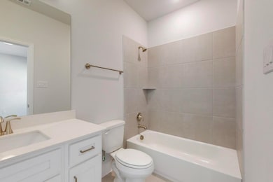 Full bathroom featuring toilet, shower / bath comb