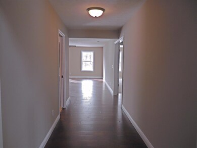 Engineered hardwood flooring, wide hallways, and a