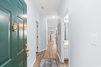 Hall featuring light wood-style floors and baseboards