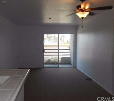 View from front door across living room to sliding