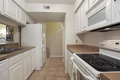 Kitchen view; refrigerator remains.