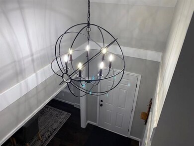 Sculptural, sphere-shaped wrought chandelier with 