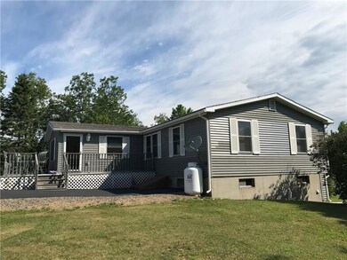 Rear side view of house with porch...